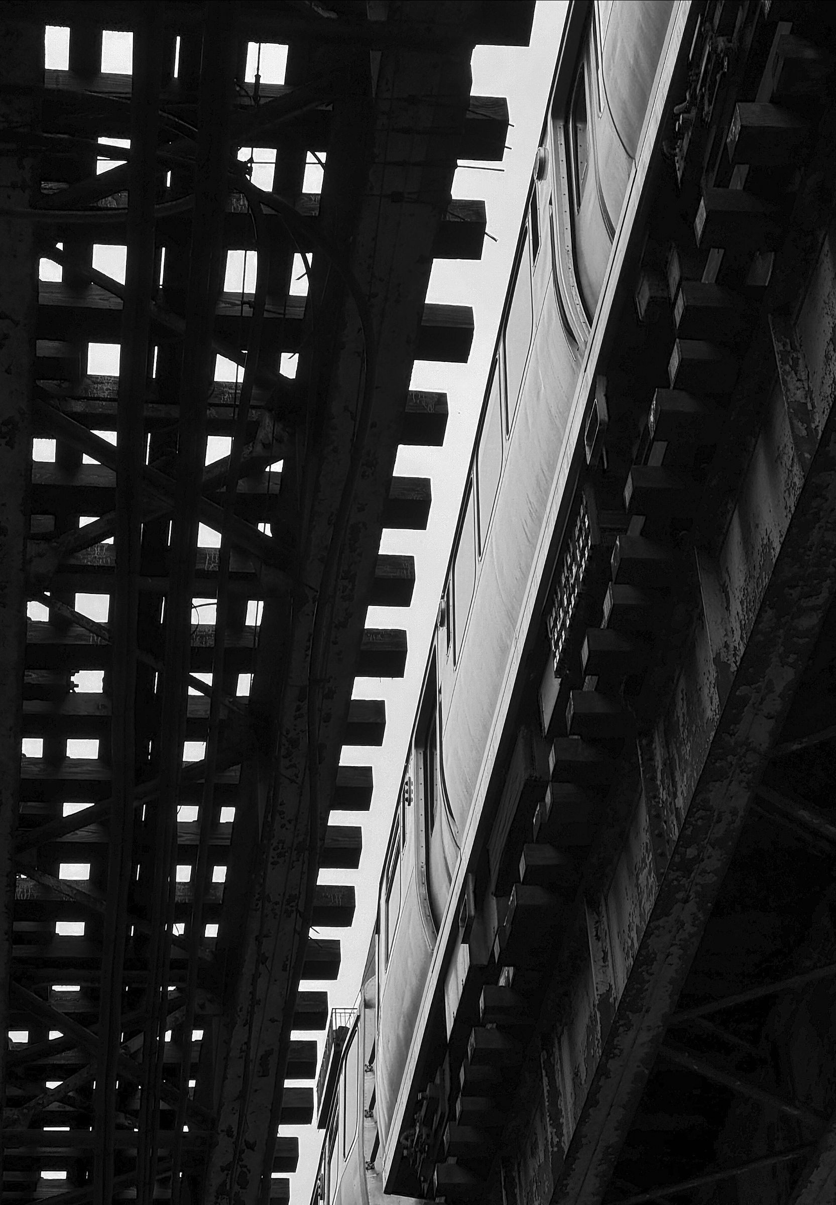 just the train above, screaming through rusted steel.